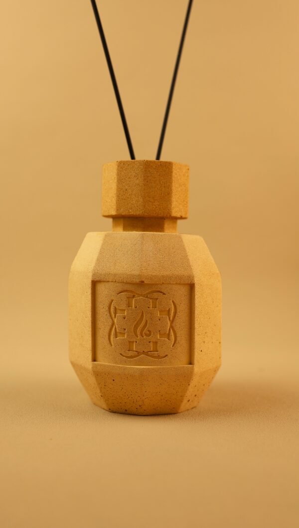 Hero image of our sandstone fragrance diffuser. Crafted to reinterpret the original sand texture, our diffusers are crafted in Bordeaux.